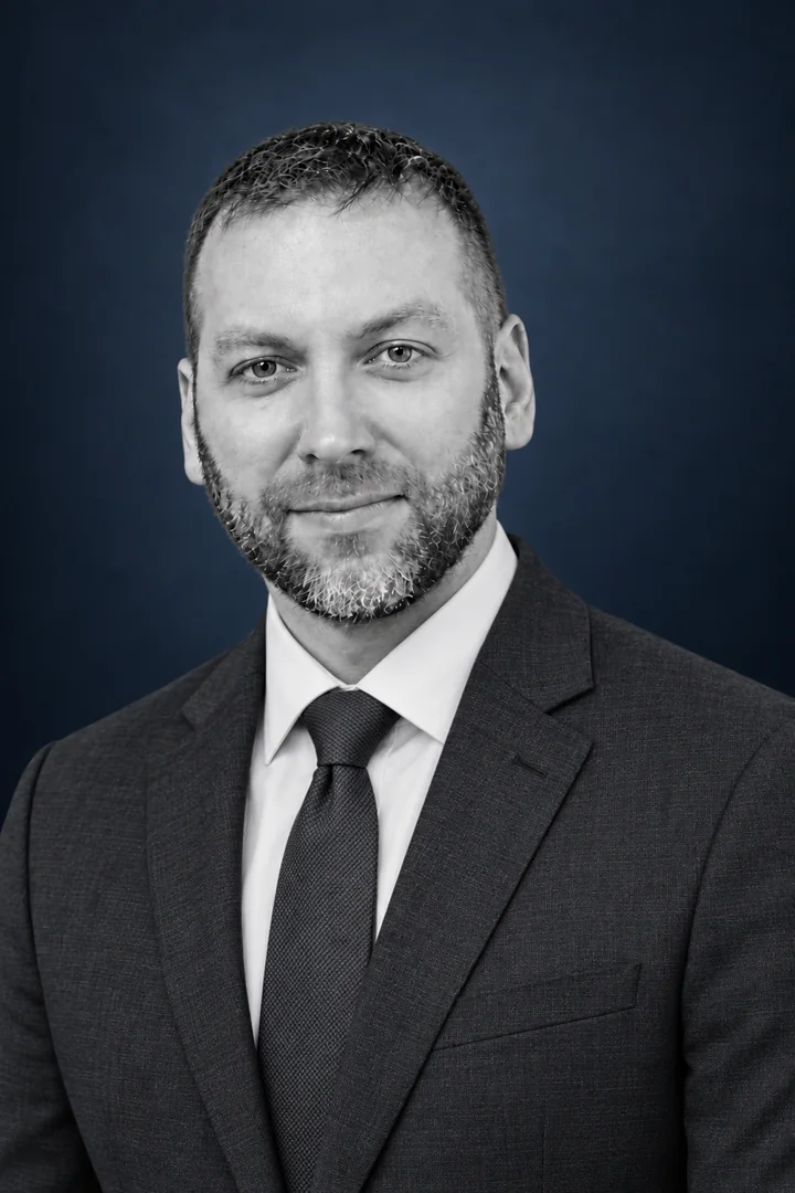 Daniel Larson in a suit and tie